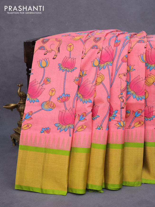 Silk cotton saree peach pink and light green with allover kalamkari prints and temple deisgn zari woven border