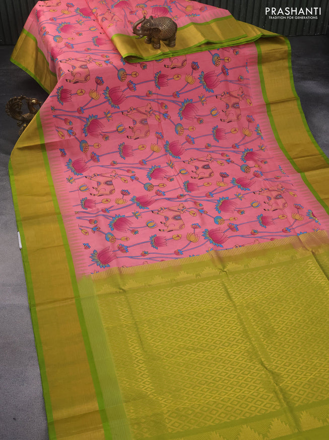 Silk cotton saree peach pink and light green with allover kalamkari prints and temple deisgn zari woven border