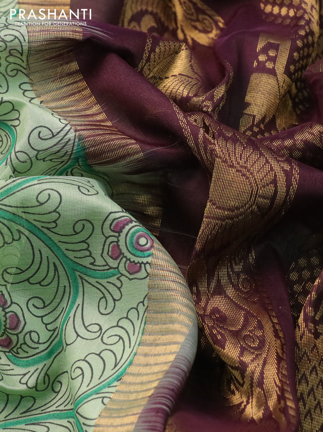 Silk cotton saree pastel green and brown with allover kalamkari prints and temple deisgn zari woven simple border