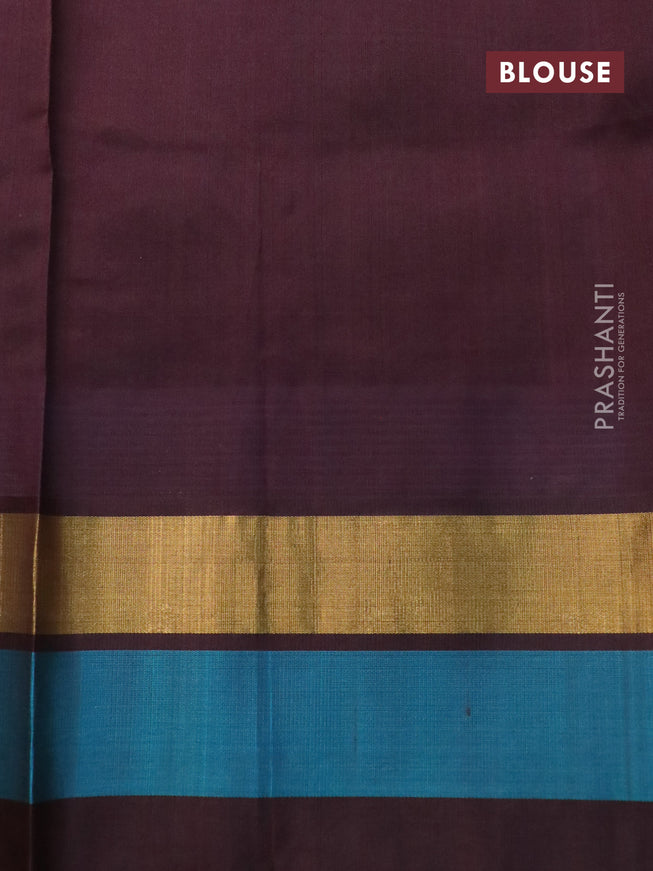 Silk cotton saree pastel green and brown with allover kalamkari prints and temple deisgn zari woven simple border