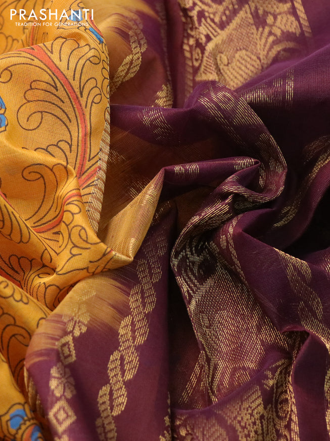 Silk cotton saree mustard yellow and wine shade with allover kalamkari prints and zari woven korvai border