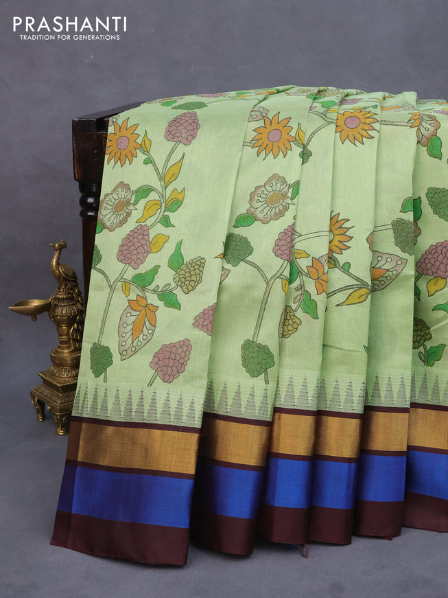 Silk cotton saree pastel green and coffee brown with allover kalamkari prints and temple design zari woven simple border