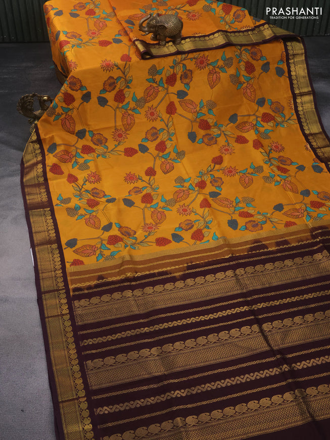 Silk cotton saree mango yellow and brown with allover kalamkari prints and zari woven korvai border