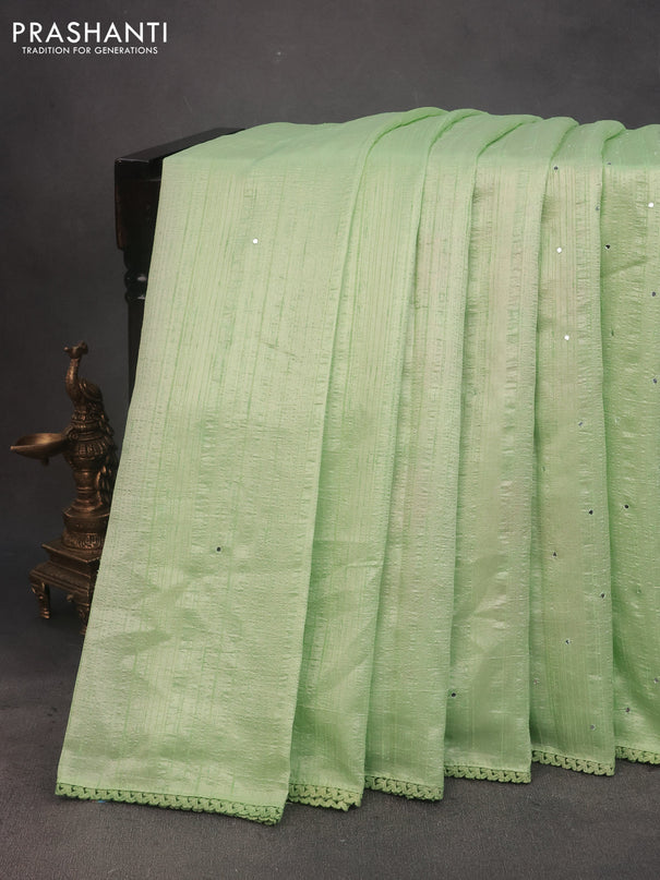 Raw silk saree pista green with allover mirror work and lace work border