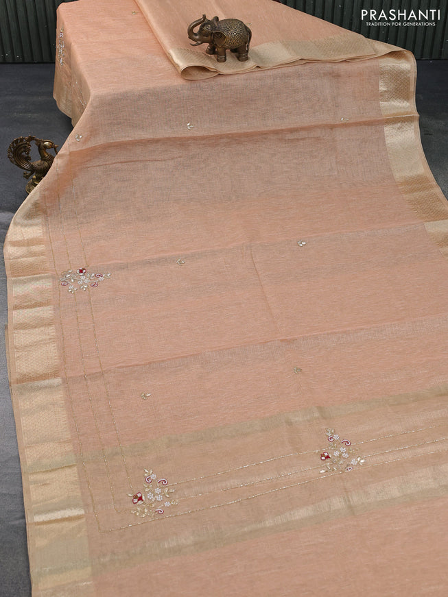 Tissue kota saree peach shade with zari weaves & embroidery work buttas and zari woven border