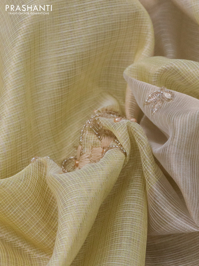 Tissue kota saree pale yellow with allover zari weaves & embroidery work buttas and zari woven border