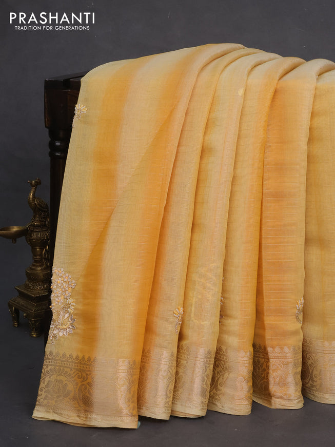 Tissue kota saree yellow shade with allover zari weaves & embroidery work buttas and zari woven border