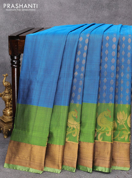 Pure uppada silk saree peacock blue and green with allover zari woven geometric weaves and floral & peacock design zari woven border