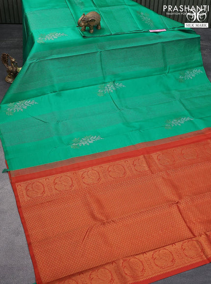 Pure kanjivaram silk saree teal green and rustic orange with allover zari weaves & buttas in borderless style