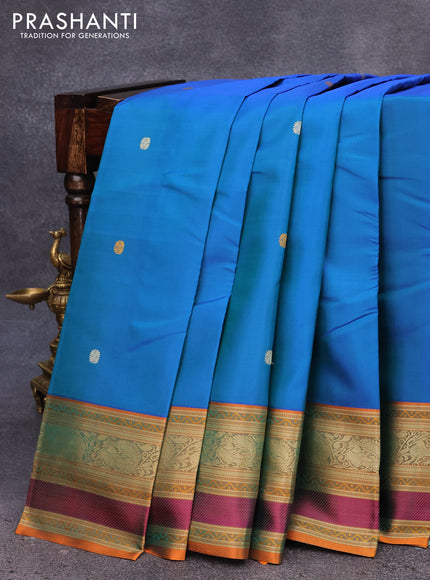 Pure kanjivaram silk saree dual shade of bluish green and dual shade of orange with thread woven buttas and thread woven border