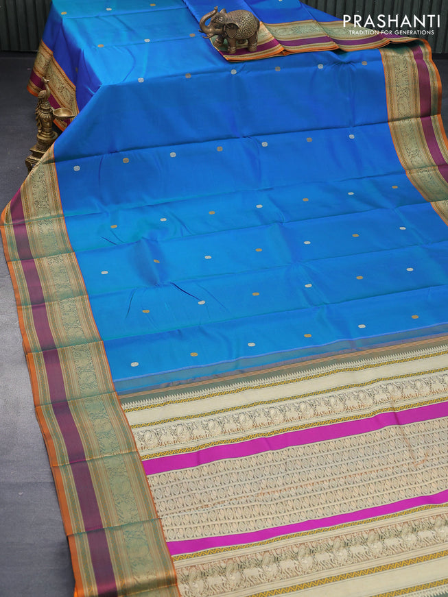 Pure kanjivaram silk saree dual shade of bluish green and dual shade of orange with thread woven buttas and thread woven border