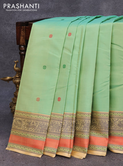 Pure kanjivaram silk saree dual shade of pastel green and sandal with thread woven buttas and rich thread woven border