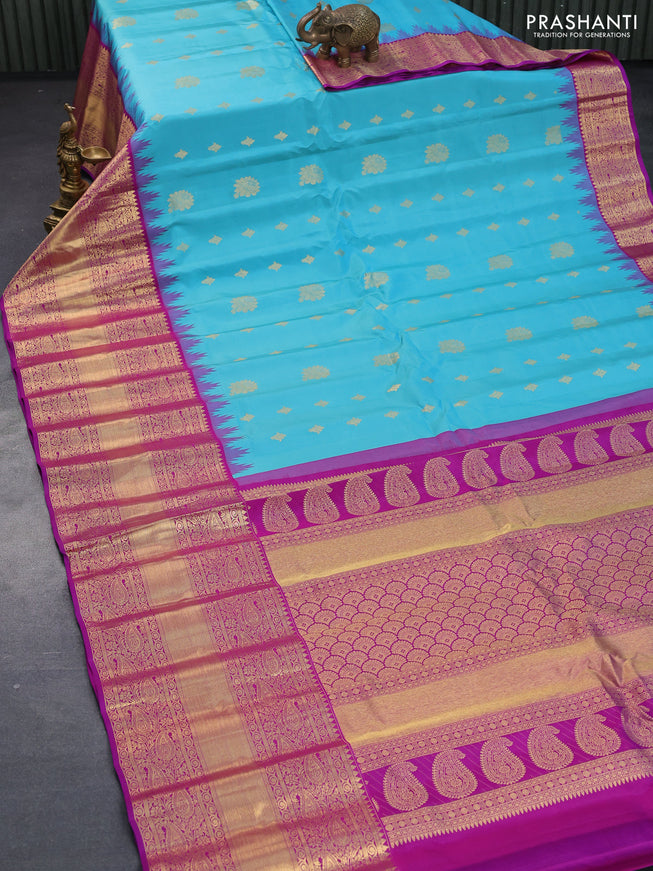 Pure gadwal silk saree light blue and purple with allover zari woven buttas and temple design long zari woven border