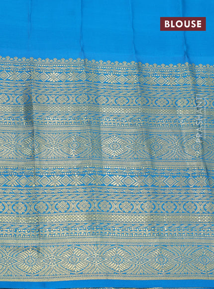 Pure gadwal silk saree green shade and cs blue with allover zari woven buttas and long zari woven border