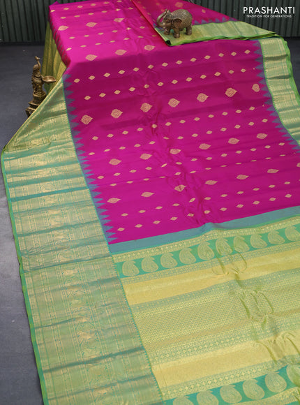 Pure gadwal silk saree magenta pink and dual shade of green with allover zari woven buttas and temple design long zari woven border