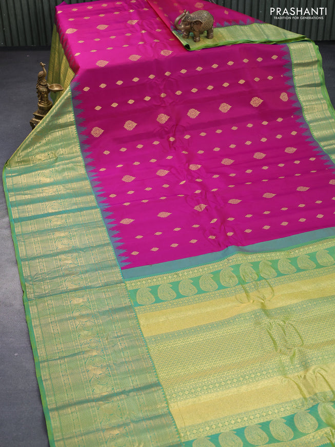 Pure gadwal silk saree magenta pink and dual shade of green with allover zari woven buttas and temple design long zari woven border