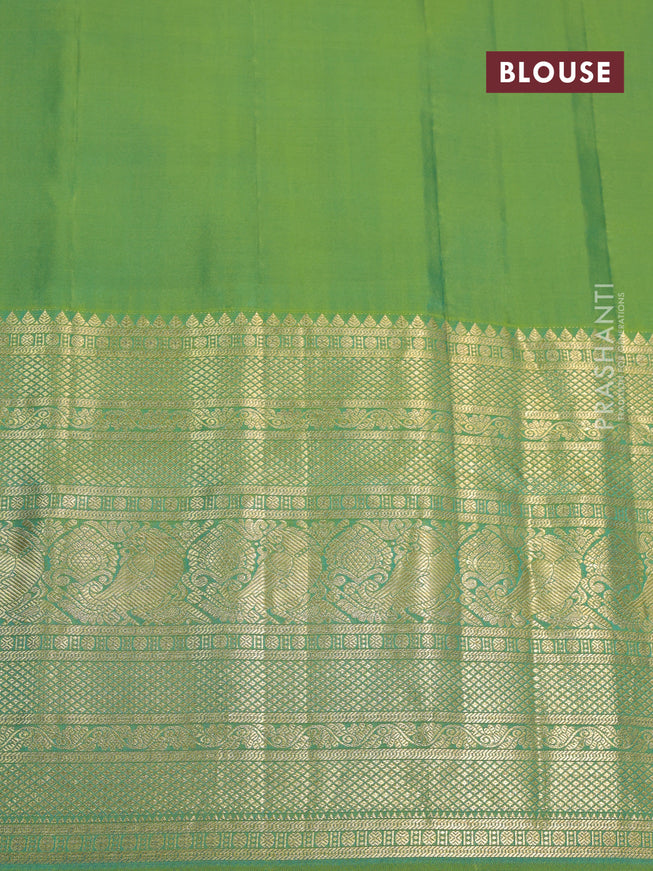 Pure gadwal silk saree magenta pink and dual shade of green with allover zari woven buttas and temple design long zari woven border