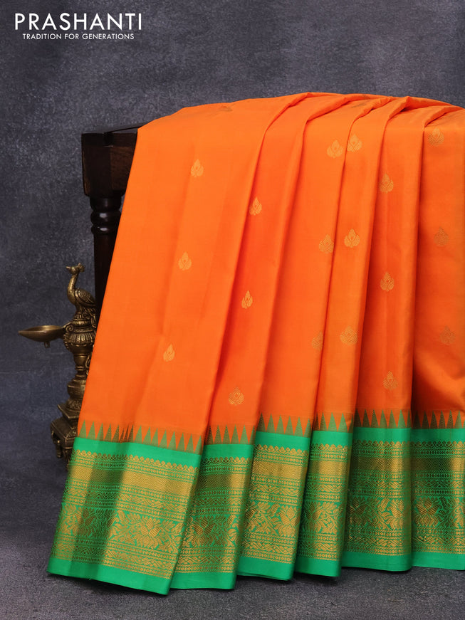 Pure gadwal silk saree orange and light green with zari woven buttas and temple design zari woven border