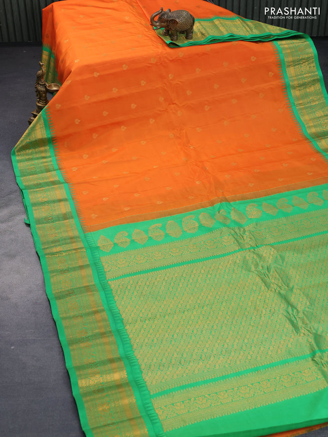 Pure gadwal silk saree orange and light green with zari woven buttas and temple design zari woven border