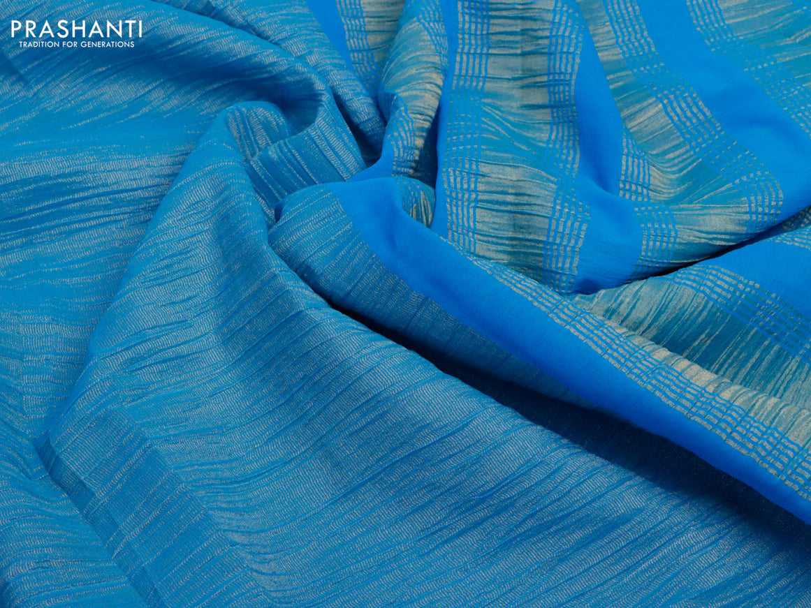 Crushed tissue saree cs blue with plain body and paisley zari woven border