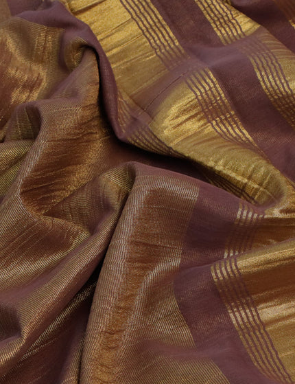 Crushed tissue saree brown shade with plain body and zari woven border