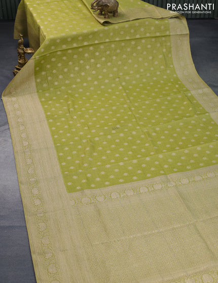 Crushed tissue saree lime green with zari woven buttas and long zari woven border