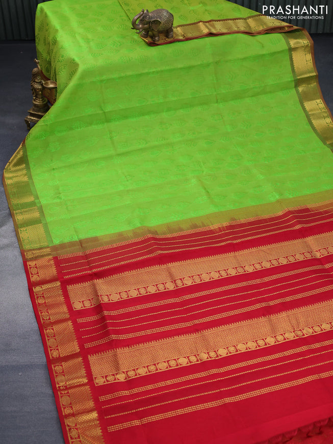 Silk cotton saree dual shade of light green and red with allover self emboss jaquard and zari woven border