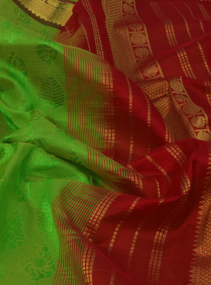 Silk cotton saree dual shade of light green and red with allover self emboss jaquard and zari woven border