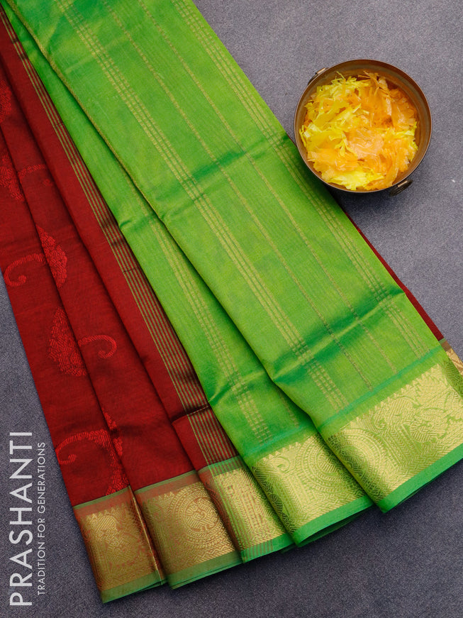 Silk cotton saree maroon and light green with allover self emboss jaquard and zari woven border