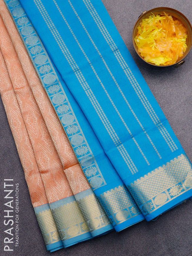 Silk cotton saree pale orange and blue with allover self emboss jaquard and zari woven border