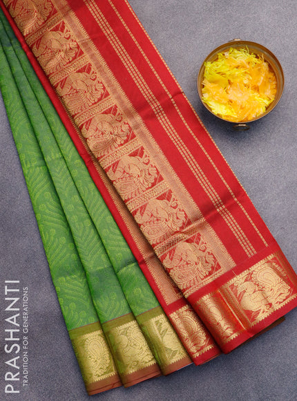 Silk cotton saree dual shade of green and kumkum red with allover self emboss jaquard and annam zari woven border