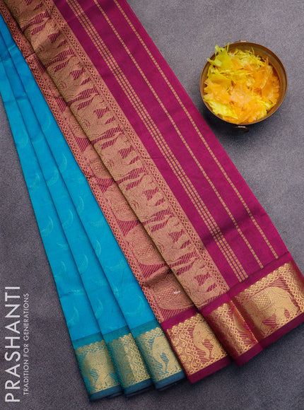 Silk cotton saree light blue and magenta pink with allover self emboss jaquard and elephant design zari woven border