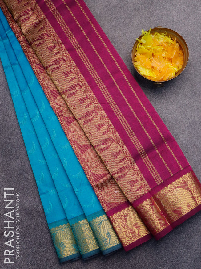 Silk cotton saree light blue and magenta pink with allover self emboss jaquard and elephant design zari woven border