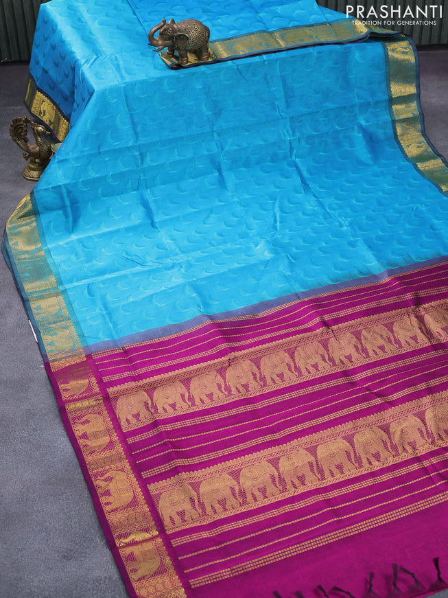 Silk cotton saree light blue and magenta pink with allover self emboss jaquard and elephant design zari woven border