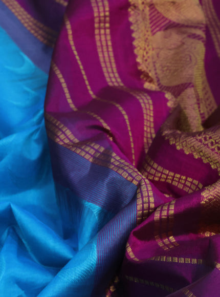 Silk cotton saree light blue and magenta pink with allover self emboss jaquard and elephant design zari woven border