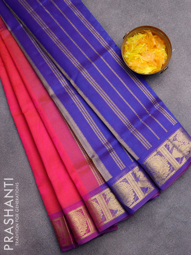 Silk cotton saree dual shade of pinkish orange and blue with allover self emboss jaquard and annam zari woven border