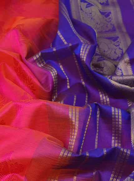 Silk cotton saree dual shade of pinkish orange and blue with allover self emboss jaquard and annam zari woven border