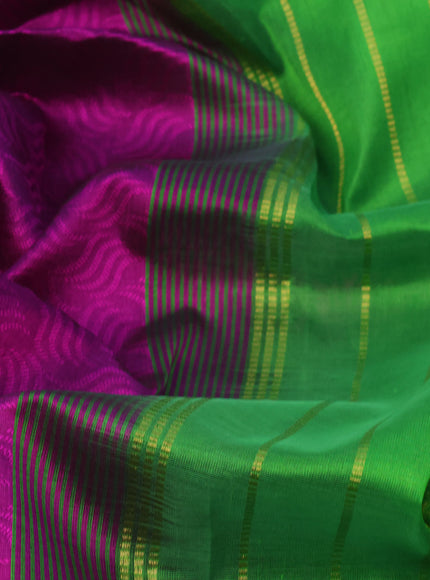 Silk cotton saree purple and green with allover self emboss jaquard and zari woven border