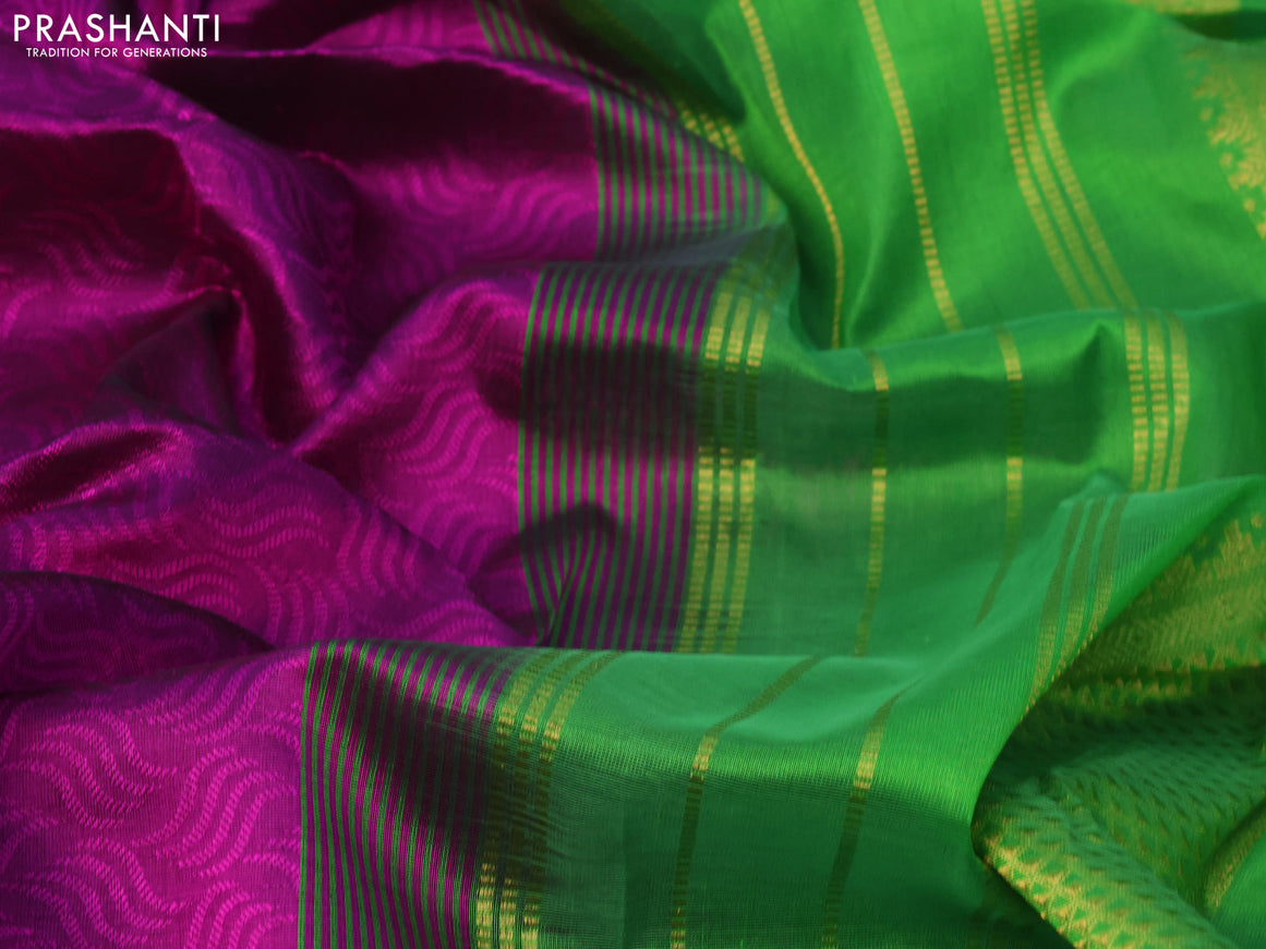 Silk cotton saree purple and green with allover self emboss jaquard and zari woven border