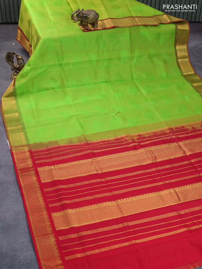 Silk cotton saree light green and red with allover self emboss jaquard and zari woven border