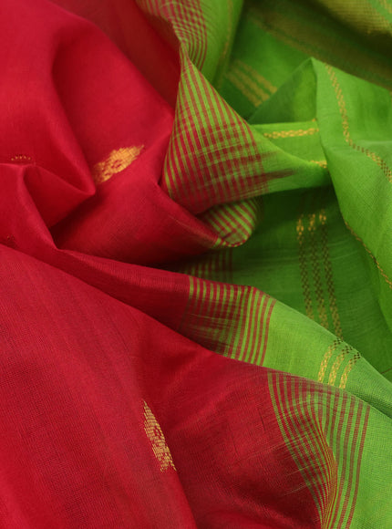 Silk cotton saree red and light green with allover zari woven buttas and zari woven border