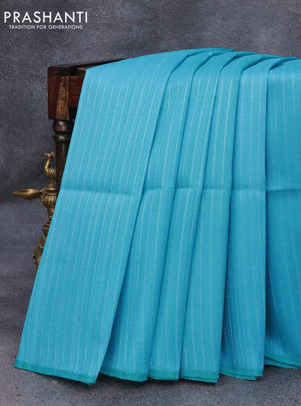 Pure raw silk saree light blue and drak mustard with allover silver zari weaves in borderless style