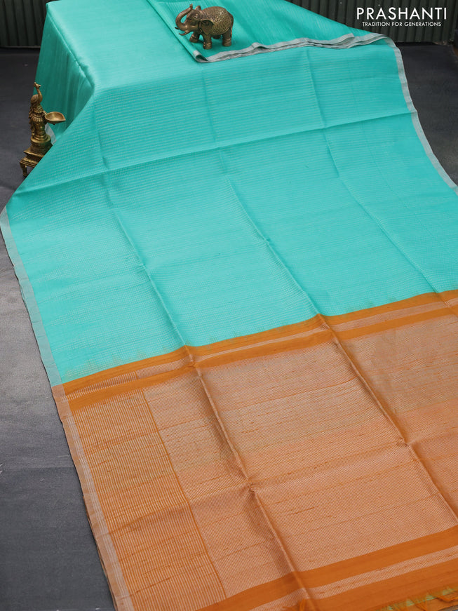 Pure raw silk saree teal blue and mustard yellow with allover silver zari weaves in borderless style