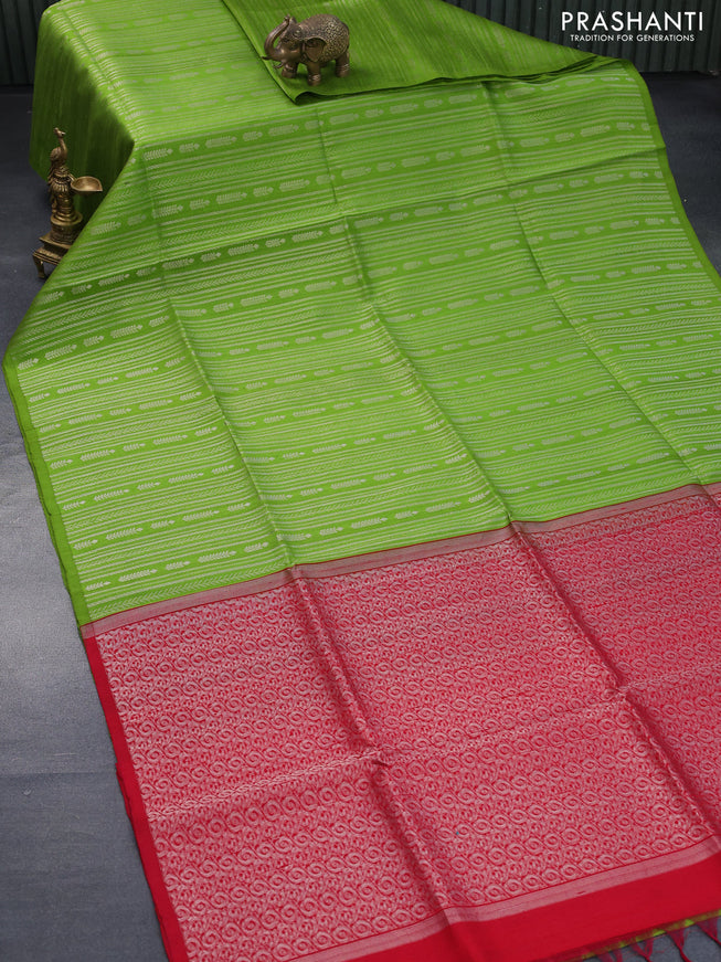 Pure raw silk saree light green and reddish pink with allover silver zari weaves in borderless style