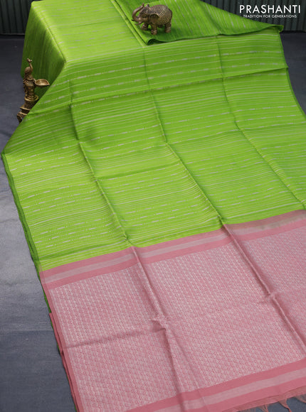 Pure raw silk saree light green and pastel brown with allover silver zari weaves in borderless style