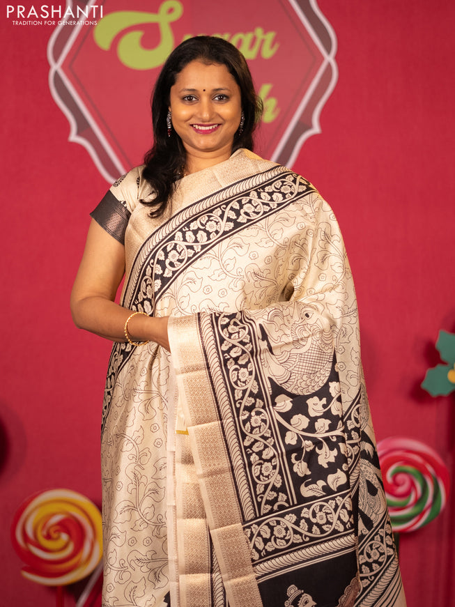 Semi raw silk saree cream and black with allover kalamkari prints and zari woven border