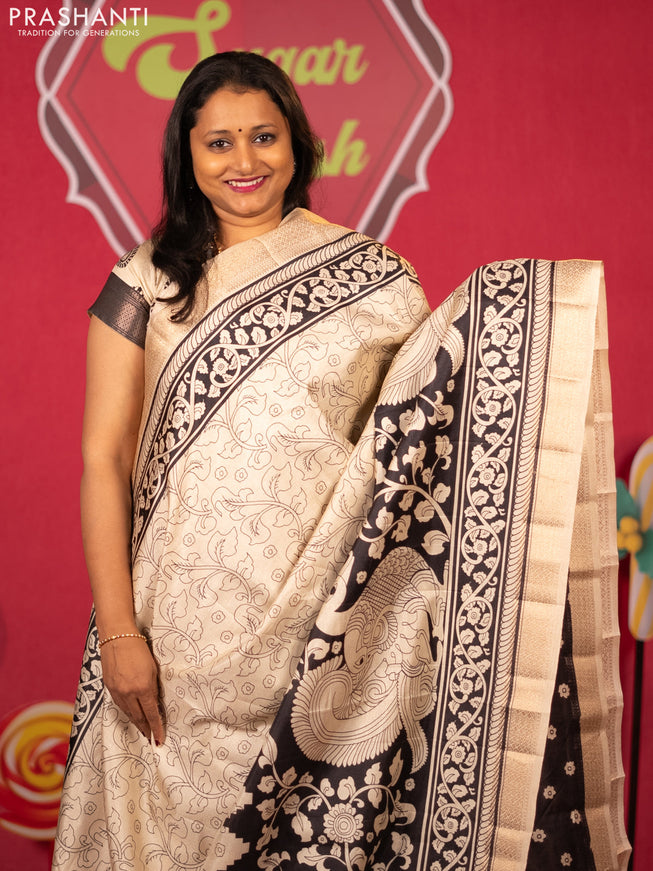 Semi raw silk saree cream and black with allover kalamkari prints and zari woven border