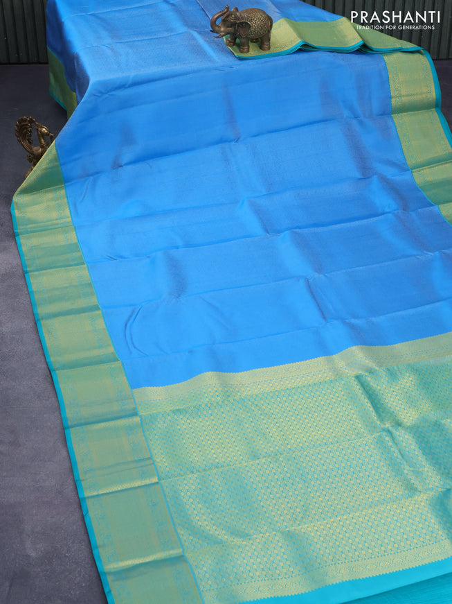 Pure kanjivaram silk saree cs blue and teal green with allover self emboss and zari woven border