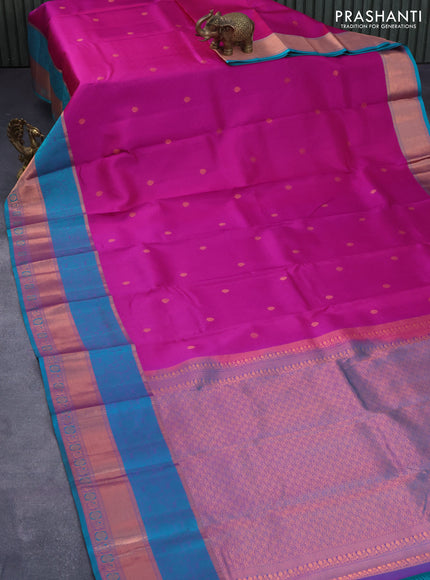 Pure kanjivaram silk saree dual shade of purple and teal green with allover self emboss & zari buttas and copper zari woven border