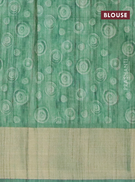 Semi matka saree green with allover geometric prints and zari woven border